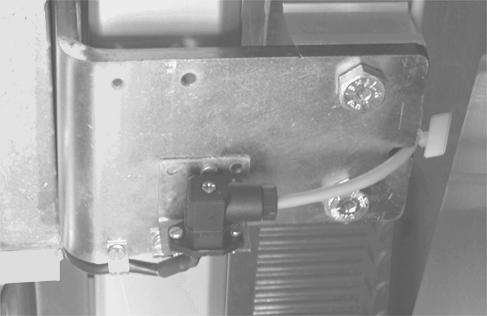 ) 3. Secure the cable to the door using the small wire clip mounted on the end of the bracket assembly. (See Figure 46.