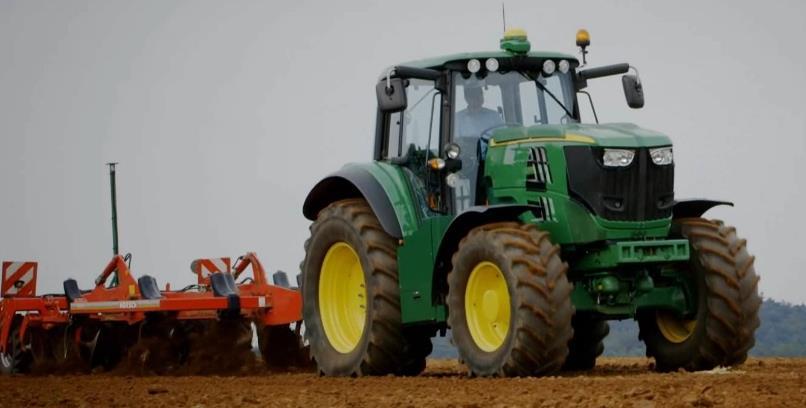 30 Figure 15 John Deere all-electric concept tractor: under-hood battery pack (left), working in field (right).