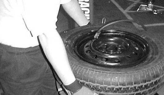 1. Connect the inflation hose to the tire valve stem making sure that the hose clip is properly secure. ( See Fig. 18 ) Fig. 18 4. Once the bead is sealed and the tire begins to inflate, step away.