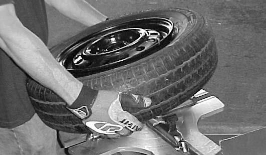 the head. See Fig. 8 for proper head position. Fig. 5 3. Depress the left front pedal ( WHEEL CLAMP CONTROL ) to activate the clamps and secure the wheel.