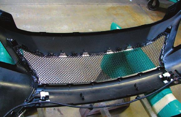 edge fits below the factory mounting tabs on the bumper cover (mesh grille shown, adaptive cruise mesh grille