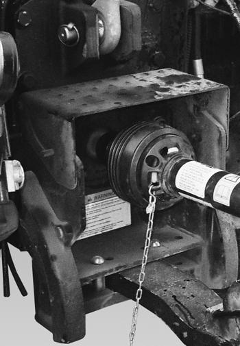 Push and pull on the PTO driveline to verify it is securely attached to the PTO shaft. Install PTO driveline safety chain (Item ) [Figure 40].