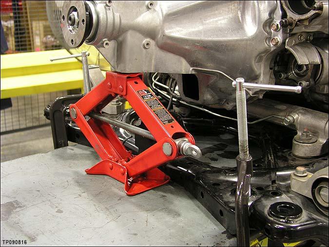 4. Apply clamps to secure the rear of the engine cradle to the support table (see Figure 4). 5.