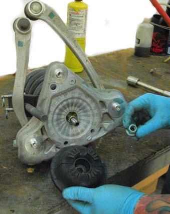 Note: You will not reuse the OEM bumpstop, the thick washer, and the nylock nut that sits on top of the damper shaft.