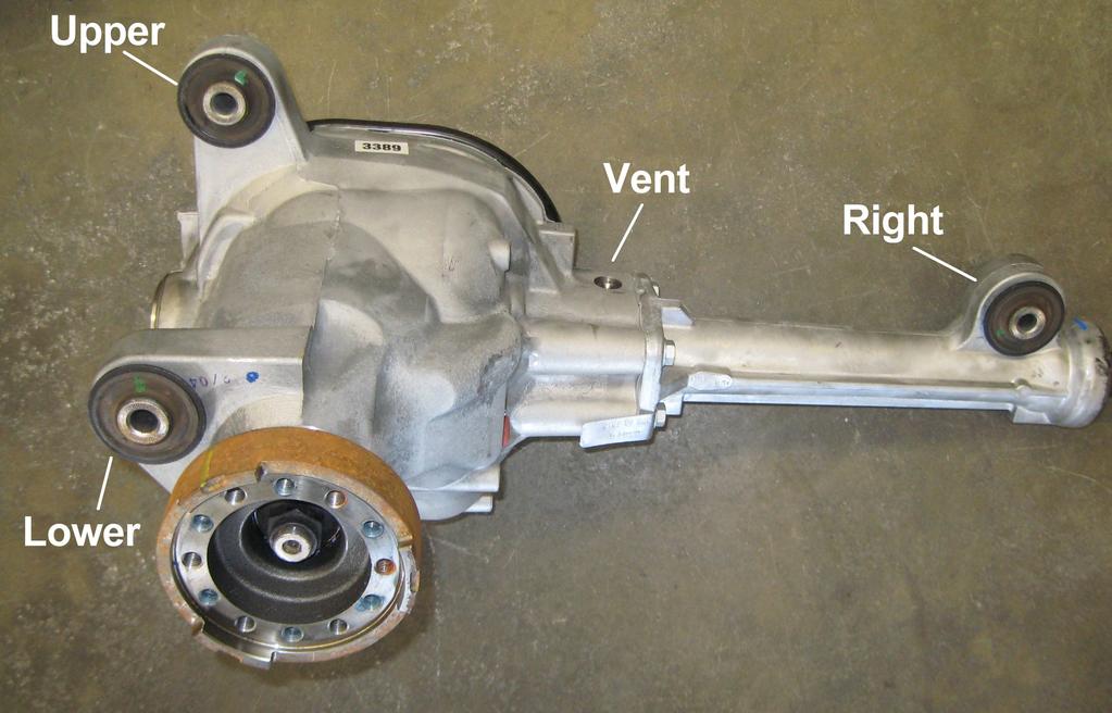 8) Remove the three shock absorber upper mount to frame nuts. Remove the shock absorber and spring assembly. See illustration 4. 7) Remove the front differential assembly lower mounting bolt.