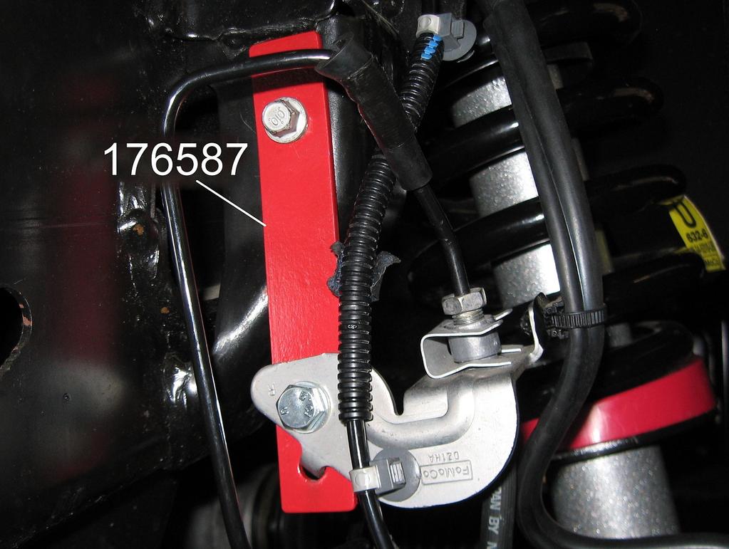 4) Using the original bolt and location, attach brake hose drop bracket 176587 to the frame rail. Tighten bolt securely.
