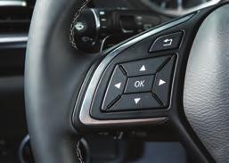 To move the head restraint backward: Press and hold the button and push the head restraint backward until it is in the desired position, then release the button.