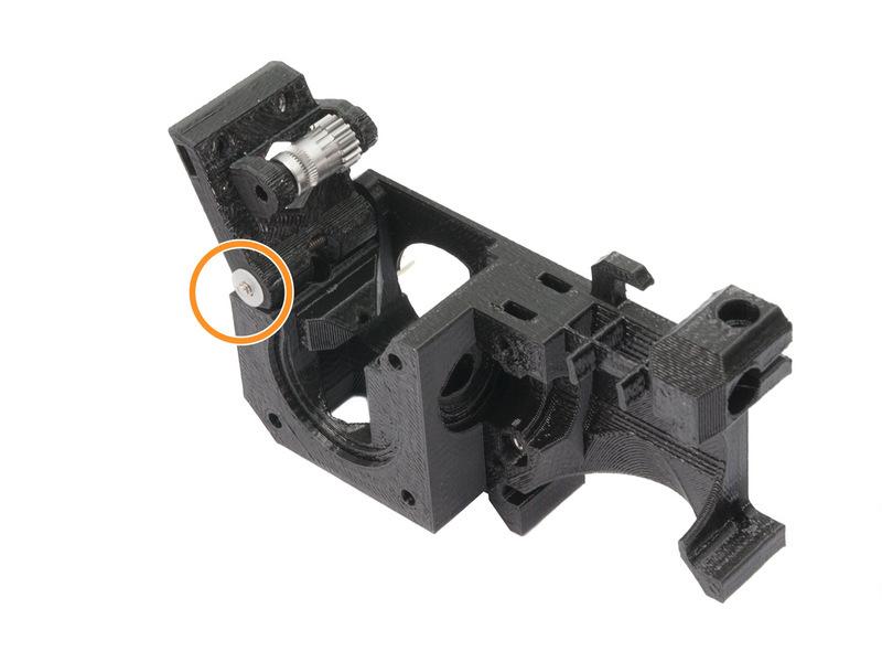 Place a washer from the other side. Assemble the idler on the M3x30 screw.