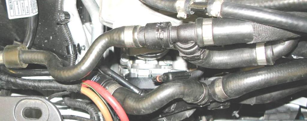 Install the two new hoses that go between the reservoir and the inner nipples on the