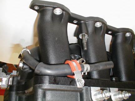 Install the Land Cruiser/LX470 throttle cable support bracket using the supplied 25.4mm (1.