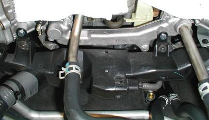 63. To allow access to the 8mm bolt on the supercharger inlet elbow (rrow, Figure 35), loosen the passenger-side bolt that secures the 9 th injector fuel rail and rotate the