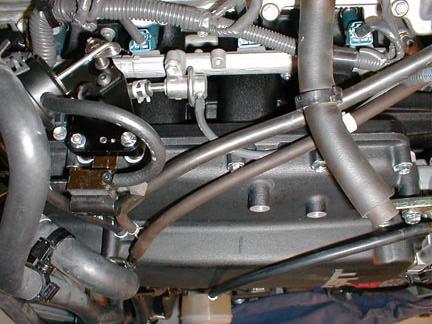 Install the supplied 7/32 x 8 long bypass actuator hose to the lower port of the boost actuator and the front (plastic) nipple on the solenoid (rrow, Figure 76). 71.