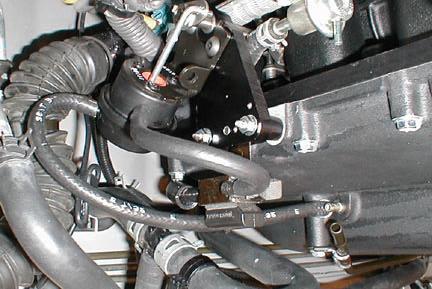 Re-connect the cam cover breather hose (rrow ), fuel pressure regulator hose (rrow ), EVP canister hose (rrow C), and power steering idle-up hose (rrow D) to the OE hose nipples