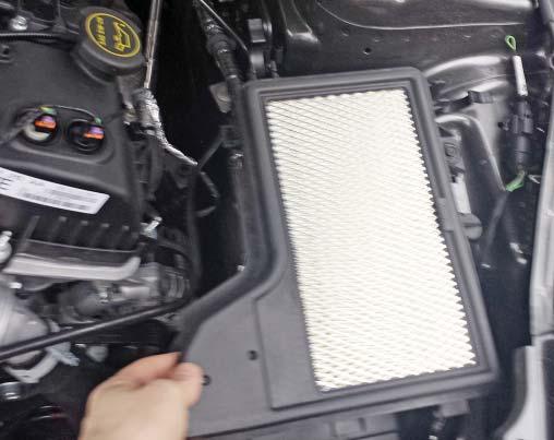 Remove the air box tray and dirty air inlet from the