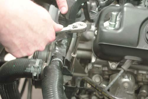 21. Use a 10 mm wrench to remove the bolt from the lower mounting bracket