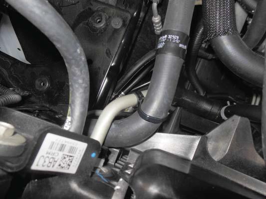 Install the plastic clamp from the last step around the oil cooler