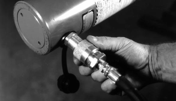 Connect the hose from the "ADV" port to the hydraulic cylinder coupler located near the base of the cylinder.