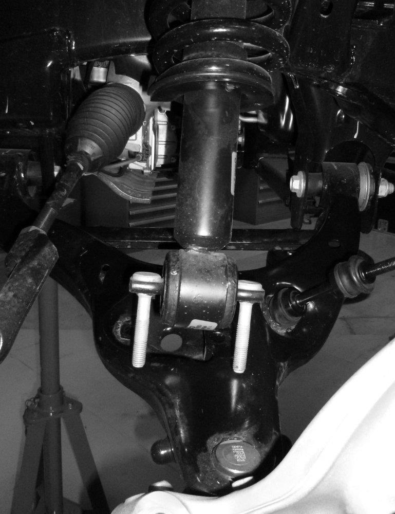 Please note that the upper control arm may be under tension from the bushing and that after removing the ball joint the lower control arm will no longer be supported and may drop downward.