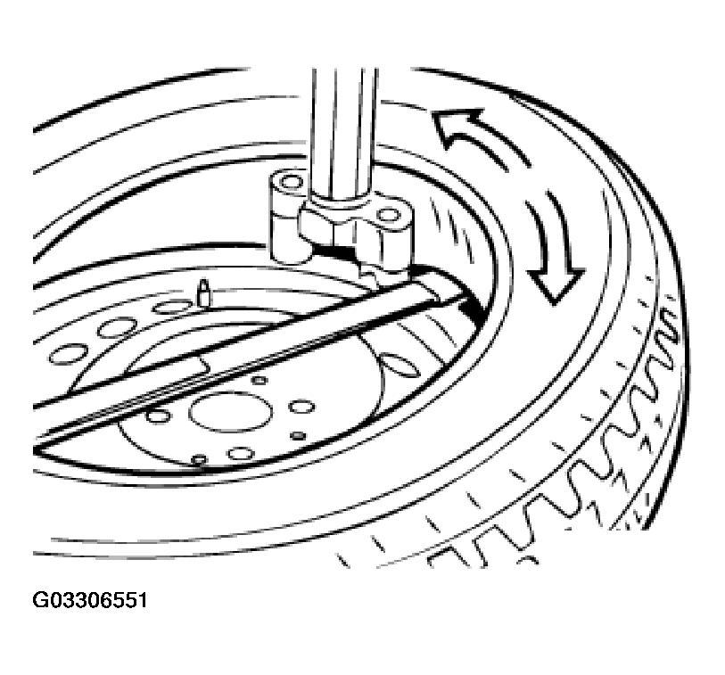 Fig. 14: Lifting Lower Bead Over Mounting Finger Release lock and tilt back or swing away mounting pillar. Unclamp and clean rim. Replace valve.