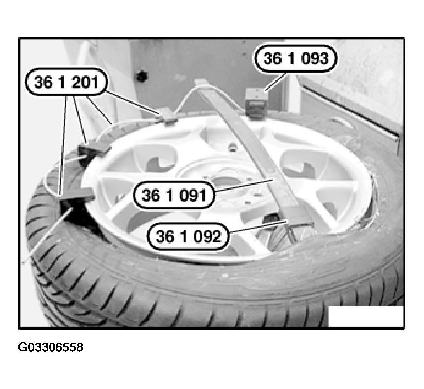 Fig. 21: View Of Special Tool 36 1 091/36 1 092 Slide second special tool 36 1 091 / 36 1 092 on right next to first special tool 36 1 091 / 36 1 092 between tire bead and rim flange.