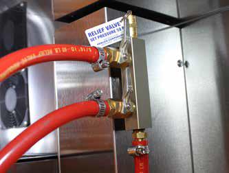 7. If installing a two faucet system, a CO2 manifold will need to be installed. Locate the red CO2 lines, CO2 manifold and a #10 x 1/2 sheet metal screw.