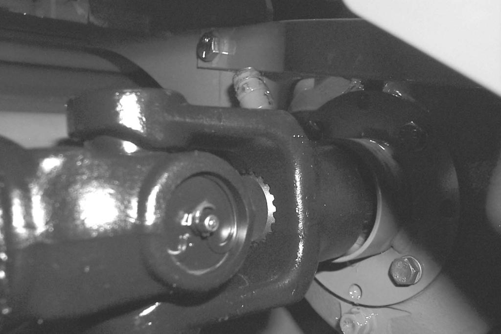 The fill plug is located on the top, rear corner of the bottom header gearbox.