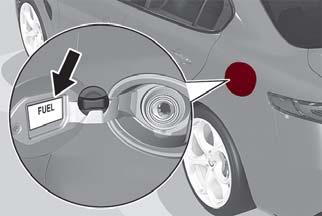 Open fuel filler door by pressing on the point shown by the arrow. Caution!