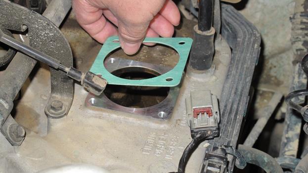 (Figure 3-17) After cleaning the gasket surface place the