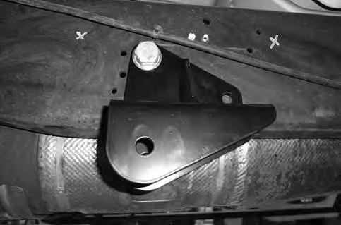 FIGURE 13 28. 1999-2010 Models Only: Some Models require the exhaust hanger bracket to be flipped on the passenger side.