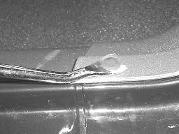 Using a panel removal tool remove the four plastic retainers (three in front door opening and one in rear door opening) securing the driver s side sill plate and B pillar post cover. Fig. 8 13.
