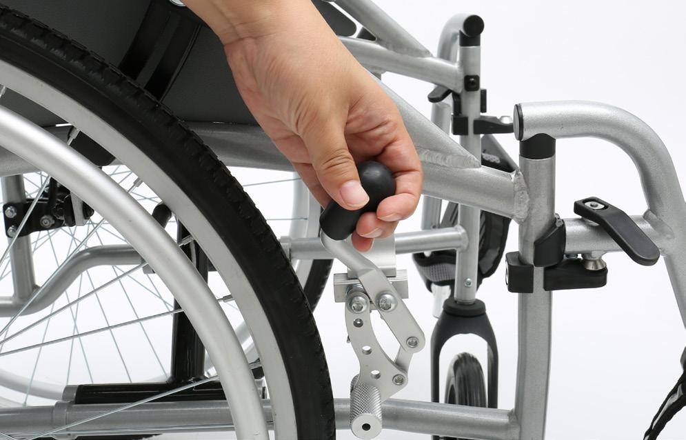 the side of the wheelchair, as shown in images 10 and 11.