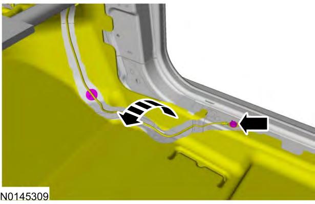 2013 Escape 9 28. Position the remaining light engine to the passenger side floor console lower trim panel, as shown. Secure the light engine using the kit provided screws.