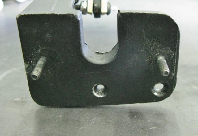 Remove the wiper door motor assembly from the wiper door bracket. Find the center location of the 2 mounting hole locations from the previous step and center punch the bracket.