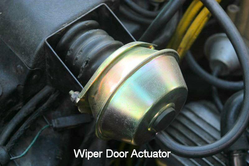 3. Remove the wiper door vacuum hoses from the actuator (Figure 2). Remove the vacuum actuator from the mounting bracket.