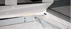 Install trim assembly by inserting hinge into slot of end bracket and sliding back into the corner.