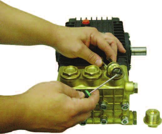 Remove valve plug using 2, 4 mm x.