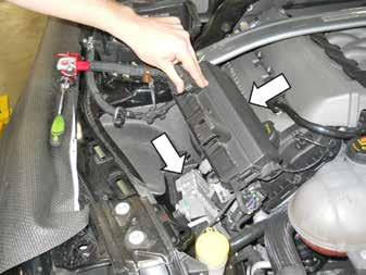 Remove the PCM by removing two (2) 10 mm bolts and pulling the PCM forward and lifting out of the engine compartment.