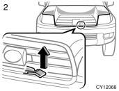 2. In front of the vehicle, pull up the auxiliary catch lever and lift the hood.
