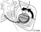 2. To remove the fuel tank cap, turn the cap counterclockwise by 90 degrees (to the pressure point 1), and then turn it an additional 30 degrees (to point 2). Pause slightly before removing it.