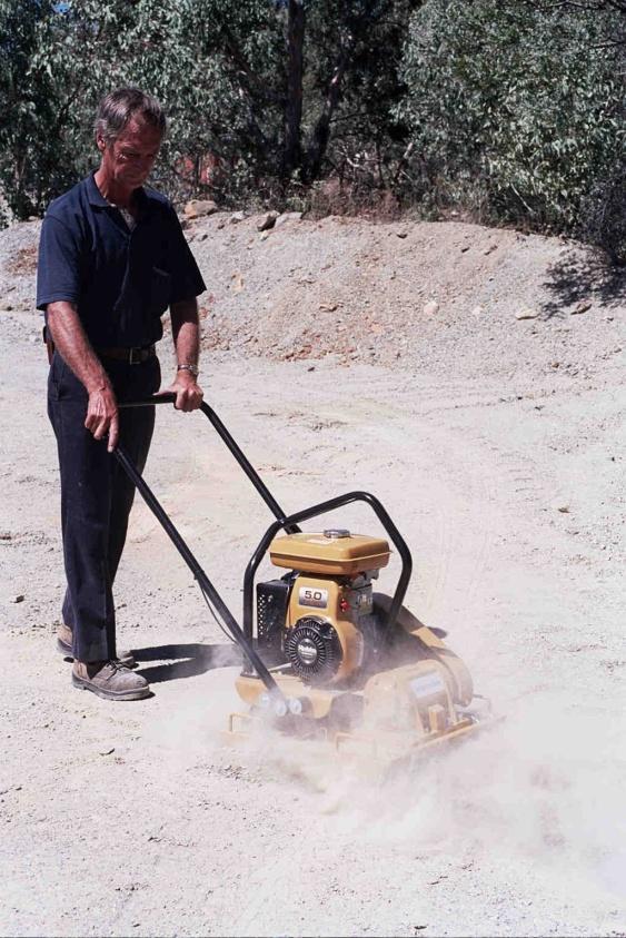 HINTS OF OPERATION During uphill compaction, it may be necessary to swing the handle over and pull the machine slightly. When compacting on a sloping terrain, the machine may tend to slide sideways.