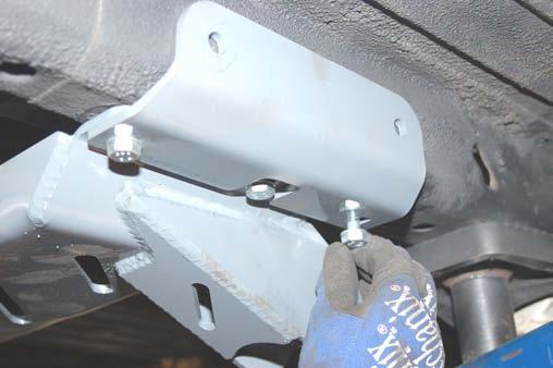 18. Install the side plates with the supplied 10mm x 35mm bolts as shown.