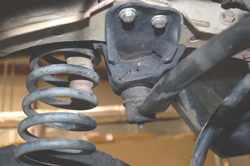 Tighten to 30 ft/lbs using a 9/16 Socket. See Photo 21. 33. Remove the track rod from the axle using a 15mm wrench /socket. 34.