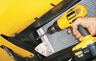 Replace the heat exchanger in its previous position in the mouth of the radiator shroud.
