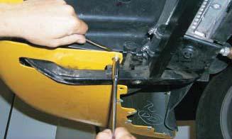 45. To secure the pump clamp bolt, slide a thin 10mm wrench in the gap between the nose cover fl ap and radiator shroud to hold the head of the