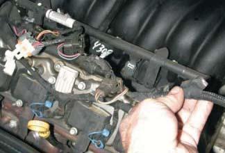 Disconnect the fuel injector wire harness from the