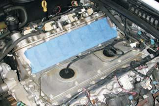 Cover the intake manifold ports with tape or clean rags to keep dirt and objects