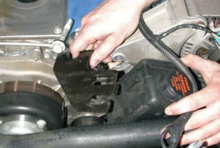 Using a 15mm socket wrench remove the two 10mm bolts that hold on the power steering