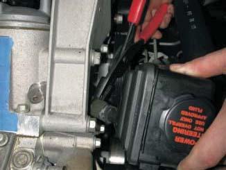 88. Using a pair of hose clamp pliers, remove the large hose clamp on the power
