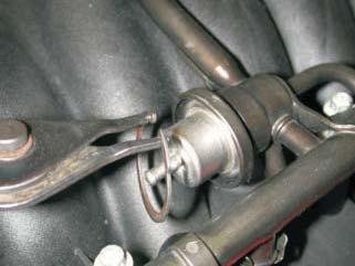 111. Using a pair of C-clip pliers, remove the stock fuel pressure regulator or