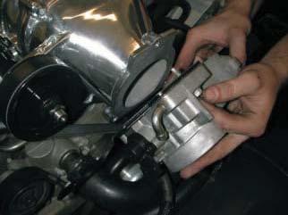 115. Install the throttle body on the supercharger manifold using the supplied gaskets, stock throttle body bolts, and